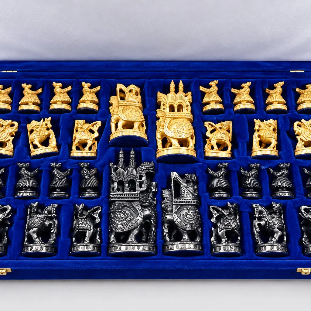 Close-up of carved wooden Ambabari chess pieces with elephant and animal designs on a chessboard