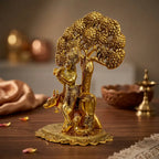 Antique-finish Krishna statue with a cow and a tree backdrop