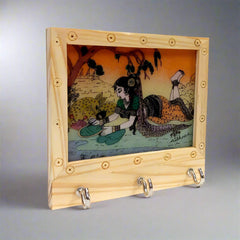 Artisan-made key holder with intricate gemstone painting, perfect for gifting.