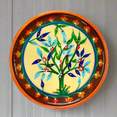 A hand-painted artistic wooden plate, designed as a captivating wall hanging.