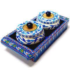 A wooden tray and container set in assorted colors, perfect for serving dry fruits.