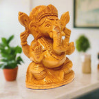 Auspicious wooden Ganeshji statue ideal for worship and home temple.