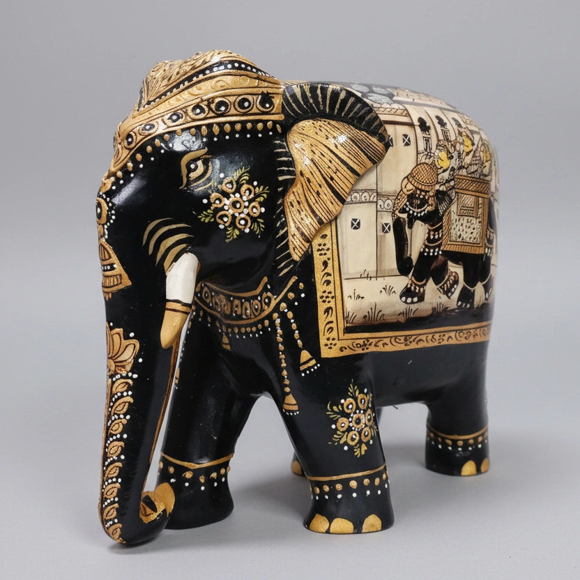 Black elephant figurine displayed on table as heritage décor piece