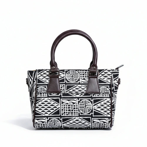 Front view of a black fabric sling bag featuring a PU leather top handle.