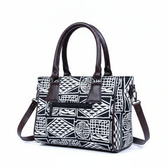 Back view showing the secure exterior zip pocket on the black 10x8 handbag.