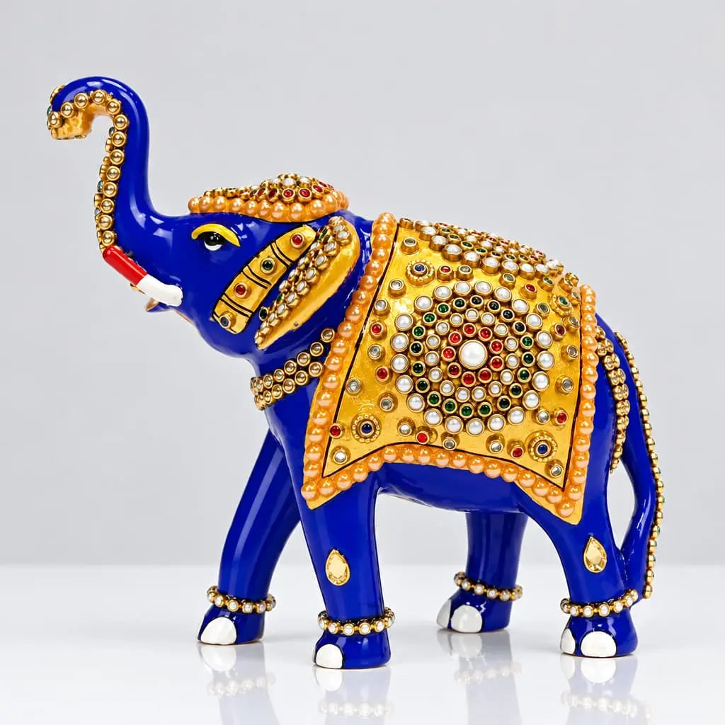 Blue Meenakari elephant statue with a raised trunk, golden saddle and multicolor stone decoration