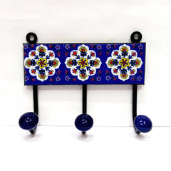 A decorative Blue Pottery 3-hook key holder, a vibrant piece for home decor.