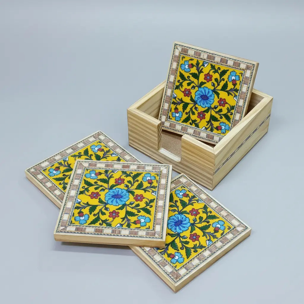 Close-up of Blue Pottery tile coaster showing vibrant floral motif and inlaid border detail