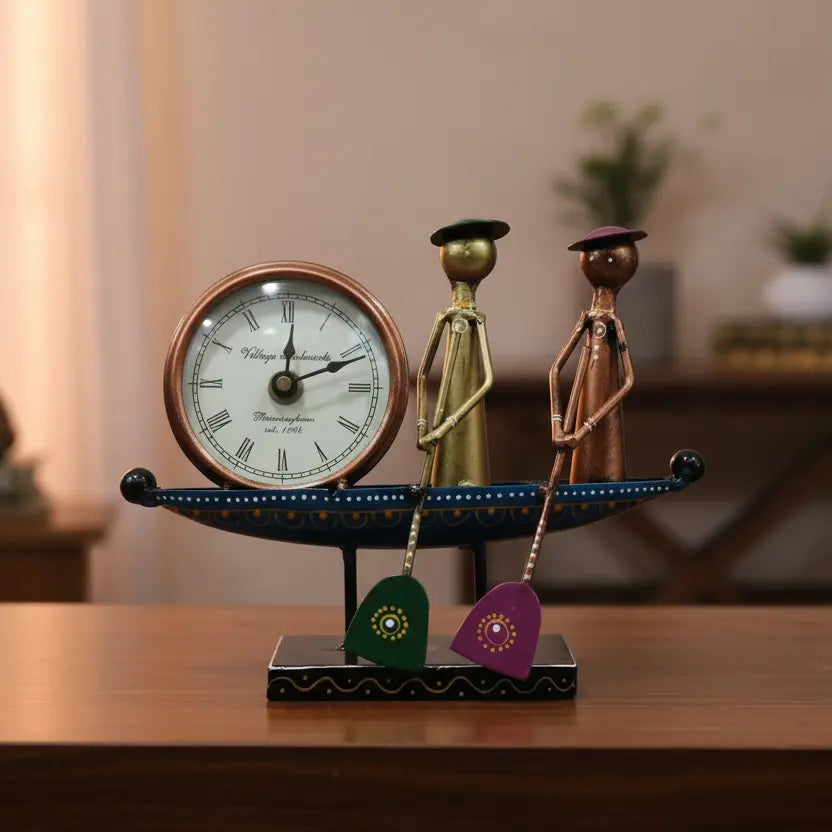Handcrafted metal boat table clock with couple figurines — front view