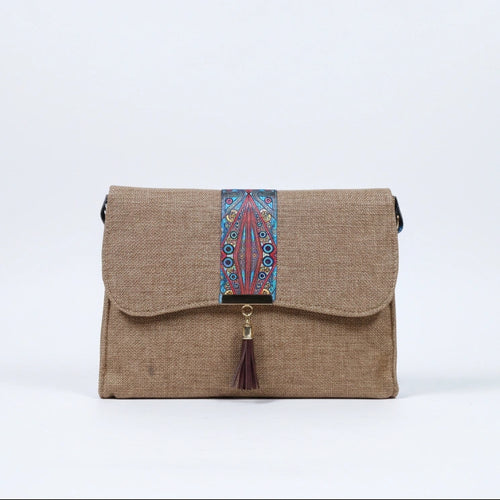Front view of a 10x8 inch boho crossbody bag with leather tassel and floral strap