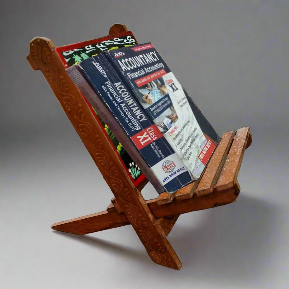 A hand-carved wooden book stand, designed to be a rustic cookbook holder for the kitchen.
