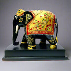 Intricately painted wooden elephant memento for home or office decor