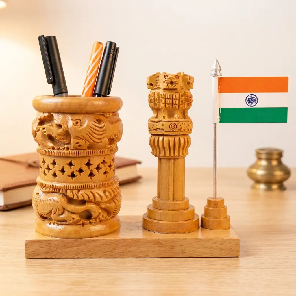 Carved wooden pen holder with animal motifs, Ashok Pillar and Indian flag on a shared wooden base beside books