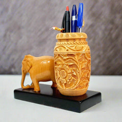 Carved wooden pen holder designed as a decorative desk accessory.