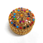 A colorful lac box with detailed stone work, ideal for storing kumkum.