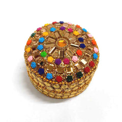A colorful lac box with detailed stone work, ideal for storing kumkum.