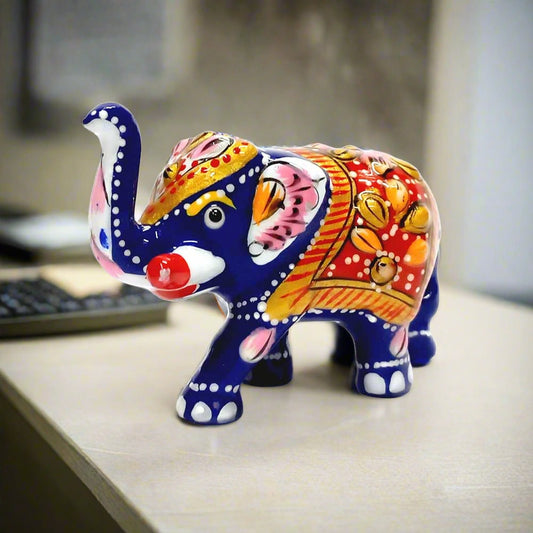 Colorful Meenakari baby elephant statue with fine detailing and enamel work.