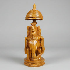 Premium wooden Ambabari elephant displayed on a modern executive office desk as a luxury gift for a boss.