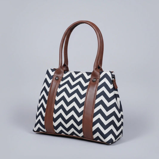 Premium cotton and leather handbag with floral ethnic print and PU handles.