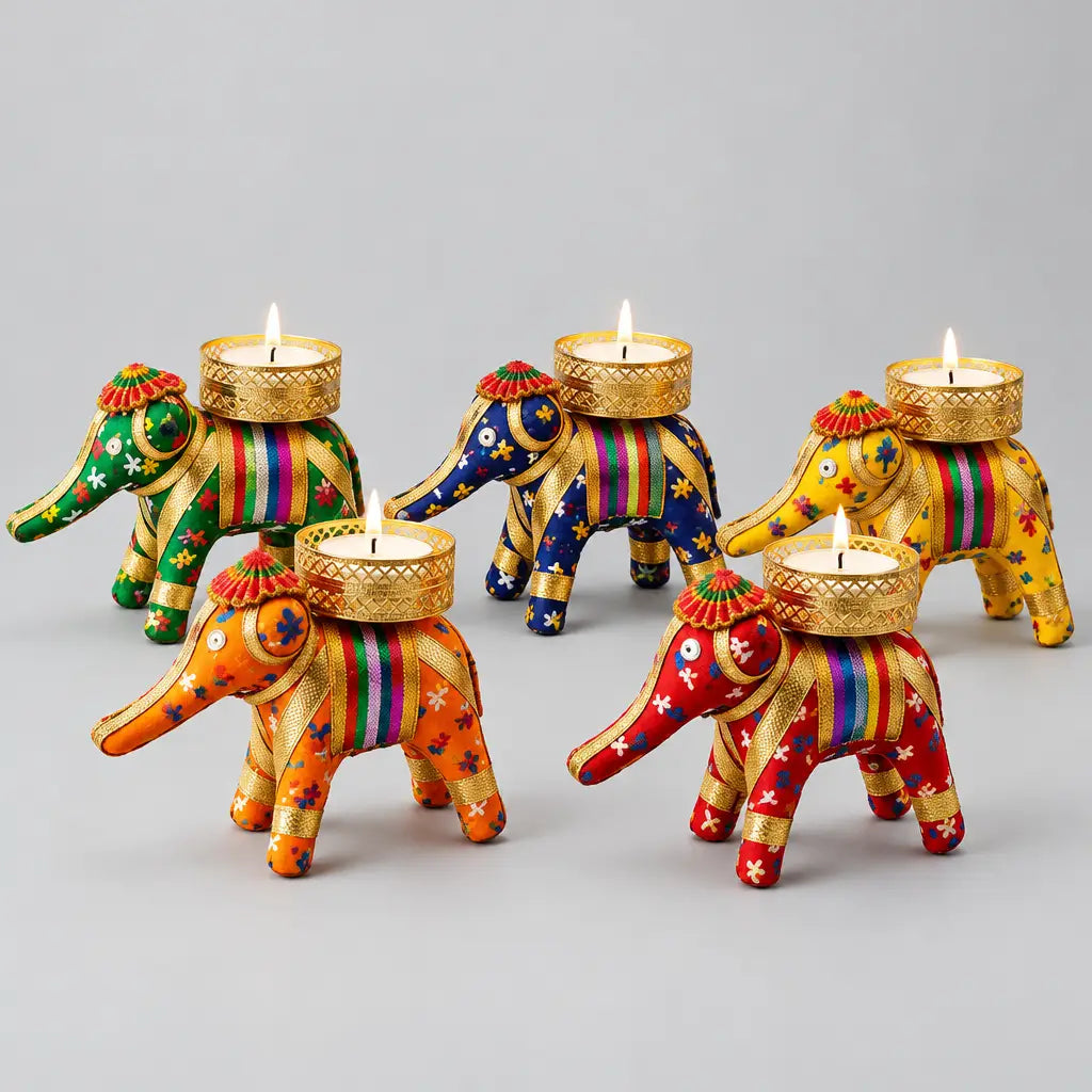Five cotton elephant tealight holders in assorted colours with lace trim, sequins and metal mesh candle cups