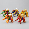 Five cotton elephant tealight holders in assorted colours with lace trim, sequins and metal mesh candle cups