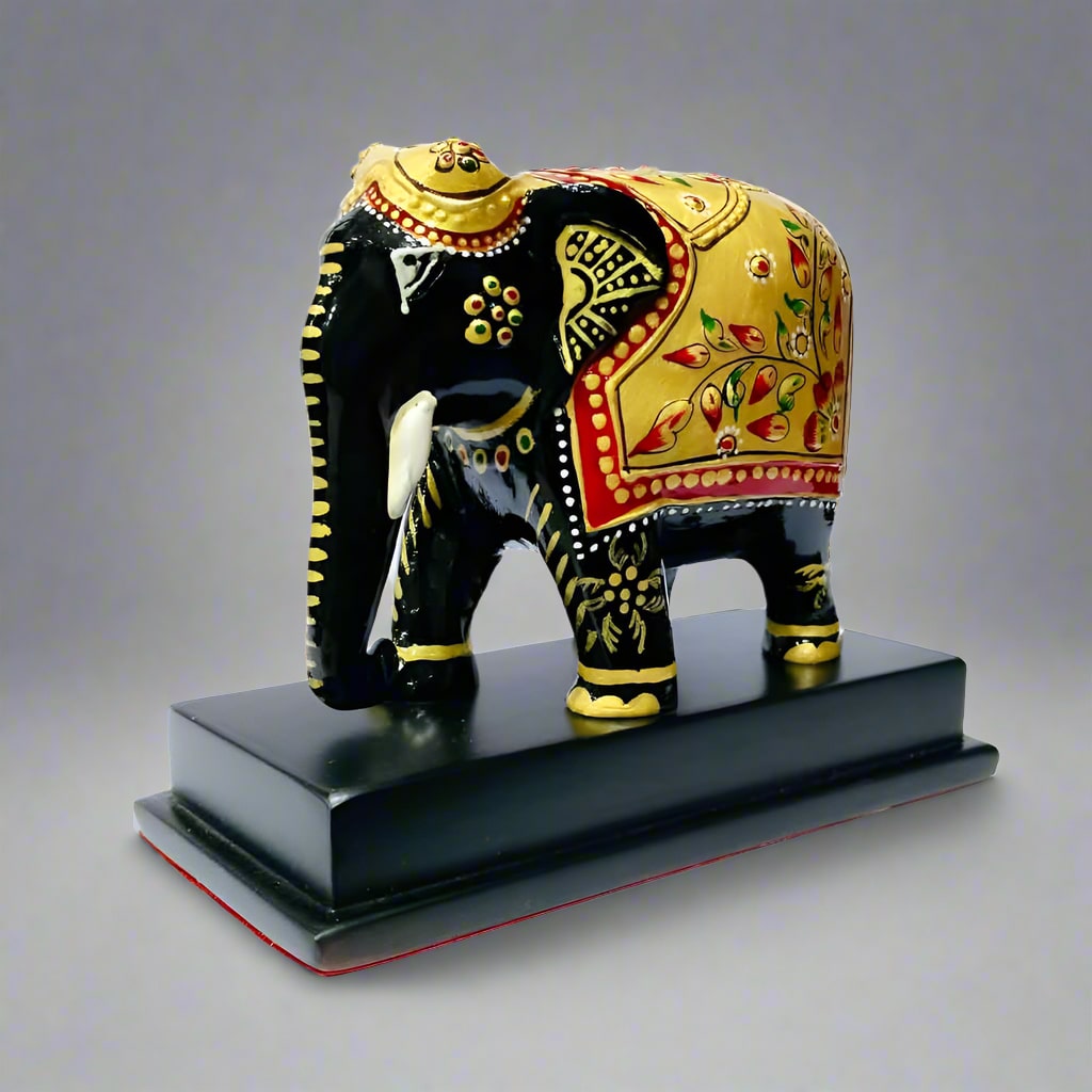 Wooden elephant memento with custom branding on the front platform, available for bulk orders.