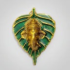 Metal leaf Ganesh showpiece with custom printing option for bride and groom names or company logos.