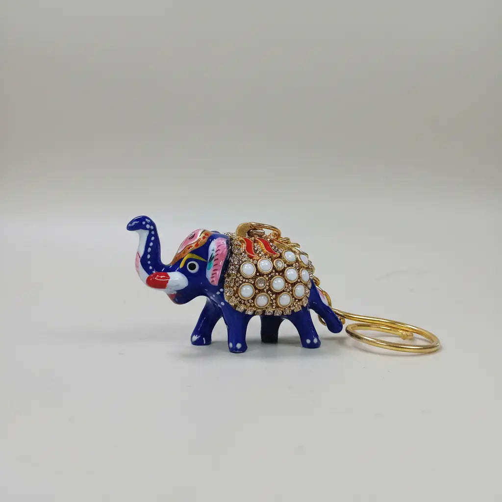 Decorative blue elephant keychain with gold-tone chain