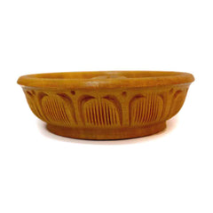 A decorative agarbatti stand with detailed wood carving for a pooja room.