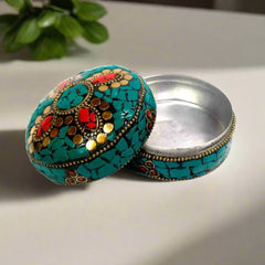 Decorative sindoor storage box featuring detailed craftsmanship