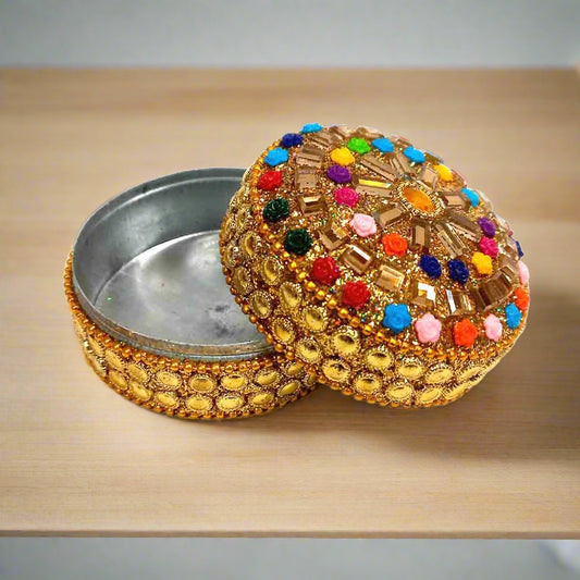A decorative lac box with a hand-art design, perfect for home decor.