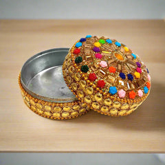 A decorative lac box with a hand-art design, perfect for home decor.