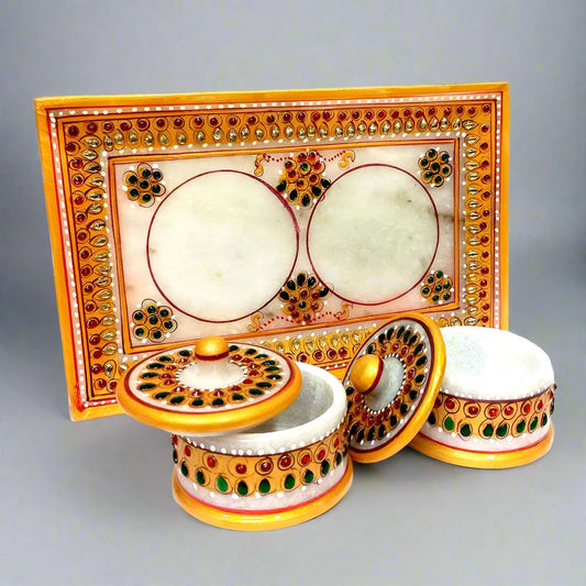 A decorative marble tray and container set, perfect for serving or display.