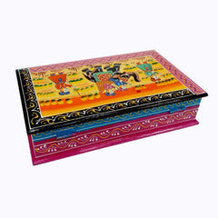 A decorative wooden box with miniature art, used as a showpiece for home decor.