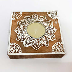 A decorative wooden candle stand, ideal for a tabletop or mantelpiece.