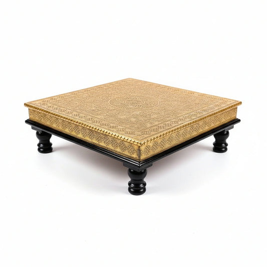Decorative wooden chowki stool featuring intricate metal sheet art in a dark brown finish.
