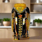 Decorative wooden elephant figurine with golden emboss and floral red-green art