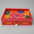 Decorative wooden tray with intricate hand-painted artwork and a convenient storage drawer underneath.