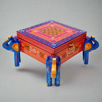 Decorative hand-painted jewelry organizer with symbolic elephant carvings, perfect for gifting or personal use.