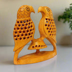 Decorative wooden parrot figurine featuring detailed undercut design.