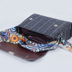 Interior shot of the textured bag showing two separate main zip compartments