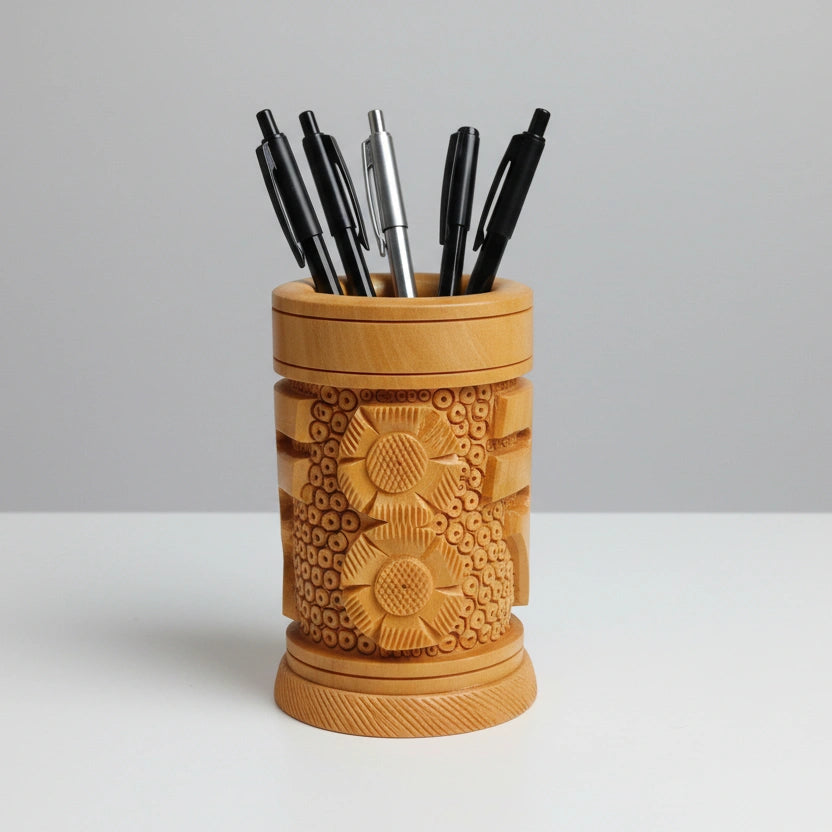 Close-up view of the ₹ symbol carved on both sides of a premium wood stationery holder for office desks.