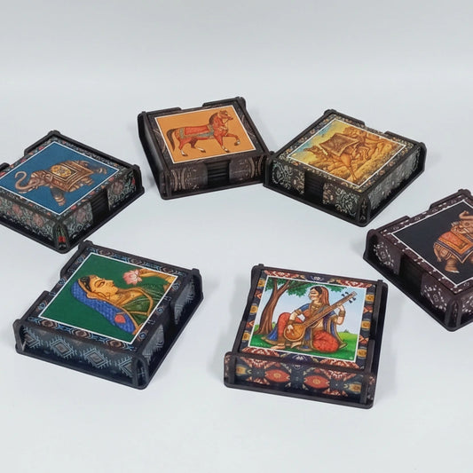 Lifestyle shot of a person placing a tea cup on a vibrant, printed wooden coaster in a cozy kitchen setting.