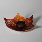 Elegant round metal lotus candle holder with bloom leaf motif, perfect for gifting on weddings and anniversaries.