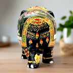 An elegant wooden elephant showpiece, a beautiful piece for tabletop decor.