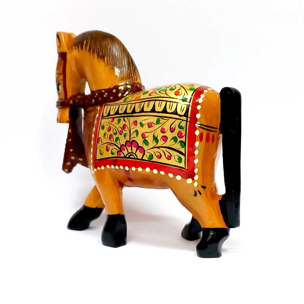 An elegant wooden horse sculpture, a beautiful and timeless decorative piece for any tabletop.