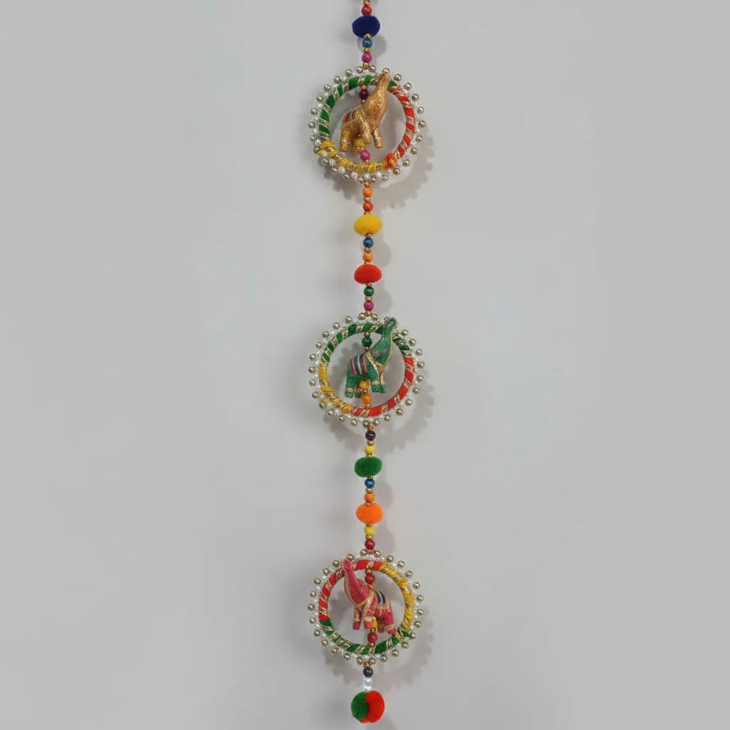Closeup of Handcrafted Elephant Ring Wall Hanging Showing Hand-Painted Fabric Elephant Figurines Inside Silver Bead Circular Frames