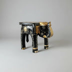 Intricate hand-painted elephant plant stand with raised gold and color motifs from Jaipur.