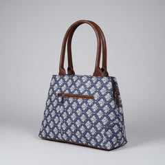 Backside view of premium cotton handbag showing the extra zip pocket and floral fabric detail.