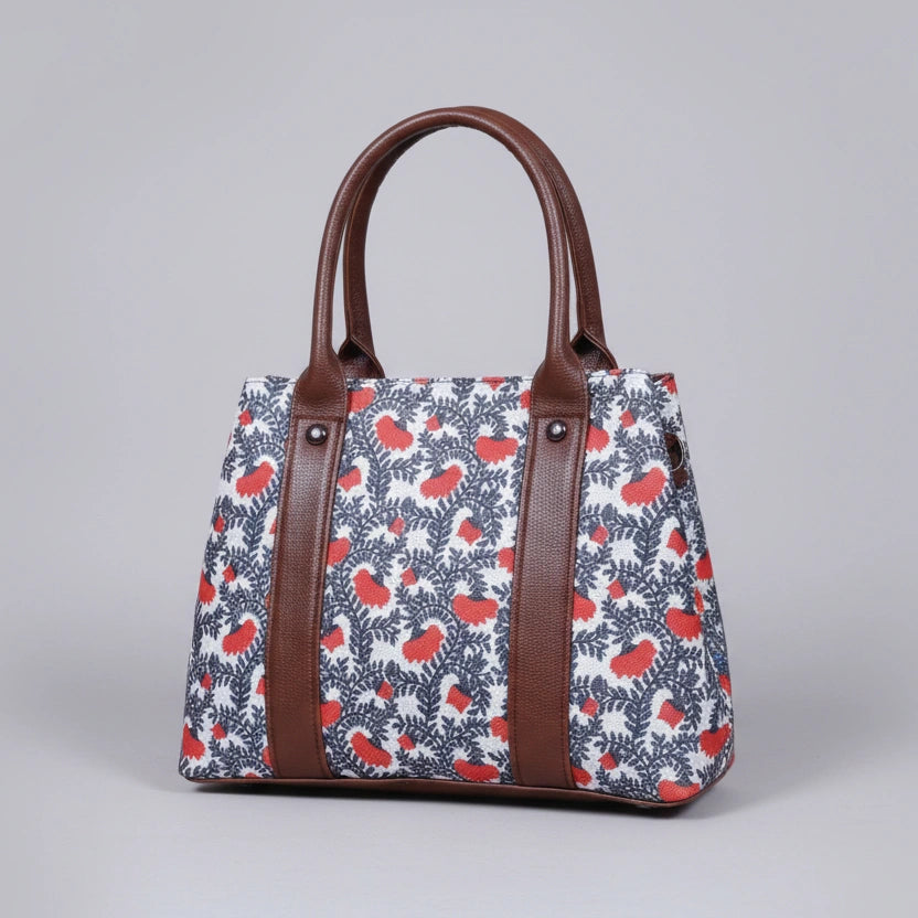 Premium floral print ethnic handbag made of cotton fabric with dual zips.